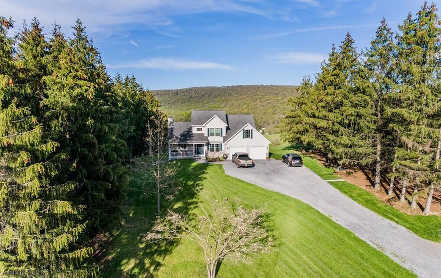 Let nature surround you in this lovely newly constructed home perched high on a mountain side in the Alleghany Mountains in South Central Pennsylvania. The home was designed around the view and the tranquil setting. First floor master suite and laundry room allows for one floor living! Enjoy the view under the lovely pergola outside the dining area, and watch nature at your doorstep on 26+/- acres. The second floor has 2 bedrooms, loft and full bathroom while an unfinished bonus space could easily allow for an additional spacious bedroom. A private guest house has two bedrooms, kitchen, living room and extra large RV garage. Large mature trees surround the property with a stream and large pond completing the oasis.