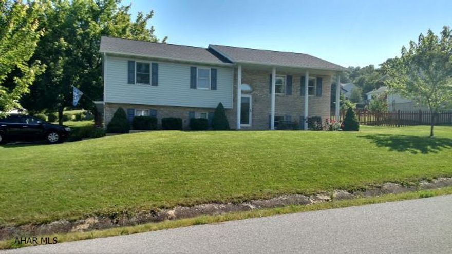 Spacious 3 bedroom, 2.5 bathroom home on a nicely landscaped, corner lot, in Rolling Hills. The large, eat-in kitchen has beautiful oak cabinets and is very bright and cheerful.  The living room and dining room are also very large.  The tiered deck off the dining room and the mature landscaping add great curb appeal to the property.  Features include a new furnace in 2015, new roof in 2012, updated bathrooms in 2014-2015, newer hot-water heater and well tank, a 2 car garage, and a shed.  Additional updates are listed on the mls.  Super home with super neighbors.