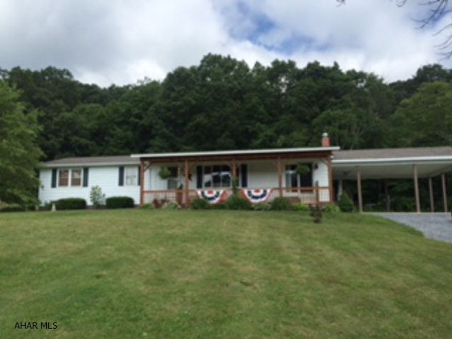 Ranch home on 4.051 acres. Pretty views, large yard, woods, carport, and detached garage. Home has 3 bedrooms, main floor laundry, partially finished basement. Basement has a great family room area, second kitchen, and plumbed for another bathroom. Very nice location and close to everything.