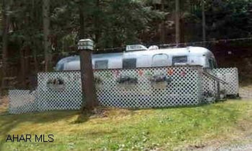 VERY WELL MAINTAINED 1974 AIR STREAM CAMPER WITH DECK AND SHED ON DEEDED LOT INSIDE GLENDALE YEAR ROUND. SLEEPS SIX, CALL JANET HARRIS AT 687-4713 OR EMAIL ; janeth21@windstream.net NEXT TO STATE GAME LANDS AND STATE PARK.  TENNIS COURTS, POOL, PLAYGROUND AND MORE