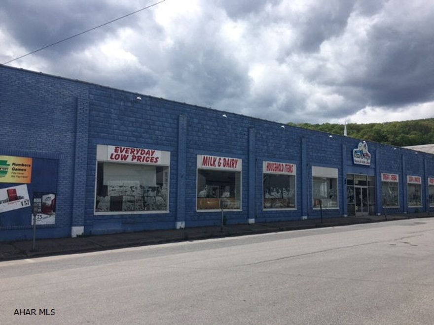 Large building in downtown Everett. Possibilities are endless. Consists of warehouse space, overhead door access, loading area, office space and kitchen area. Roof needs replaced.