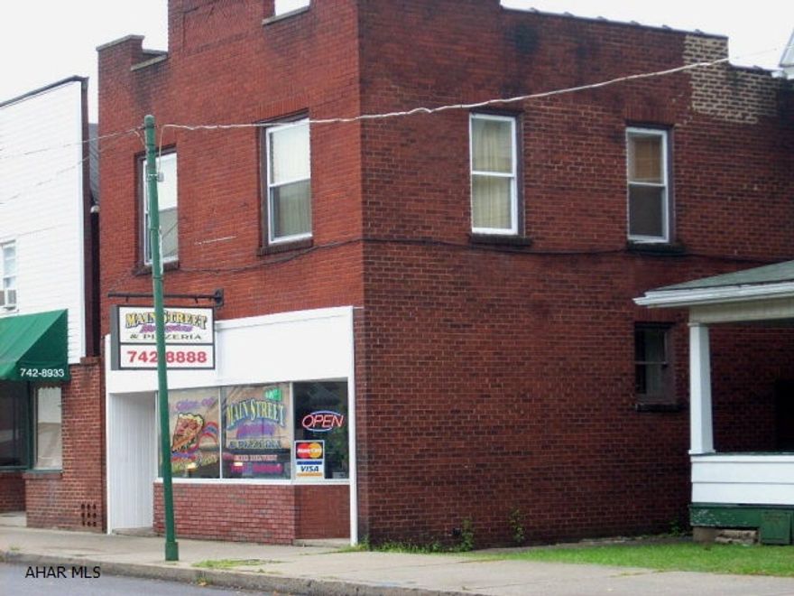 3 rental units; 1st floor commercial space renting for $550.00 pr/month (2 years remaining on lease)1st floor rear; 2 BR, 1 Bath, LVRM, kitchen (tenant pays utilities rent $330.00 pr/month.2nd floor; 2 BR, 1 Bath, LVRM, kitchen, (tenant pays utilities Rent $330.00 pr/month.