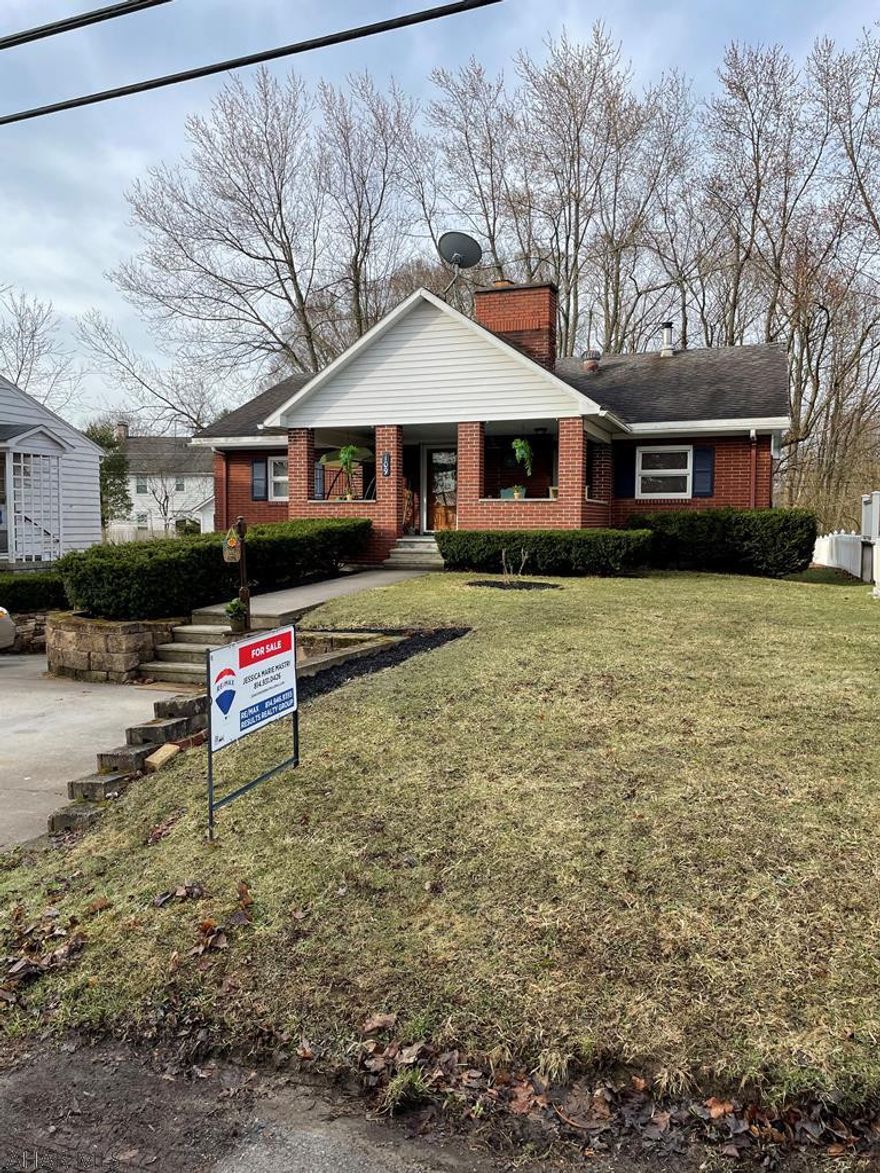 This extremely well maintained 3 bedroom 2 bath brick ranch home in Ebensburg Borough has had many updates throughout and features first floor laundry.  The large front covered porch is great for enjoying a cup of coffee or relaxing in the evening.  Enter into the living room with hardwood flooring and fireplace.  There are 2 nice sized bedrooms flanking the living room area along with a full bath with laundry.  The kitchen has been renovated and features granite counters and new appliances.  Grill on the deck out the back door.  A large master bedroom finishes out this floor.  The basement has a large family room with bar/entertaining space.  The updated 3/4 bath is perfect when entertaining guests.  Plenty of storage in the one car garage.  Larger than it looks.  Call today.