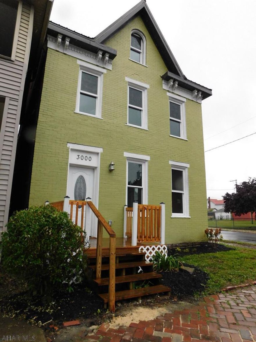 This Brick home was completely redone from the roof down.  All new windows, electric, plumbing, heating, insulation and more.  It was gutted to the studs and rebuilt.  All permits pulled and fully inspected.  A move in ready just drop your bags home!  Situated on a corner lot & Back fence can easily be pulled in for off street parking.  1st floor laundry and spacious first floor are to die for.  The master bedroom features a walk in closet and half bathroom.  Electric heat on 2nd and 3rd floor - gas forced air on 1st floor.