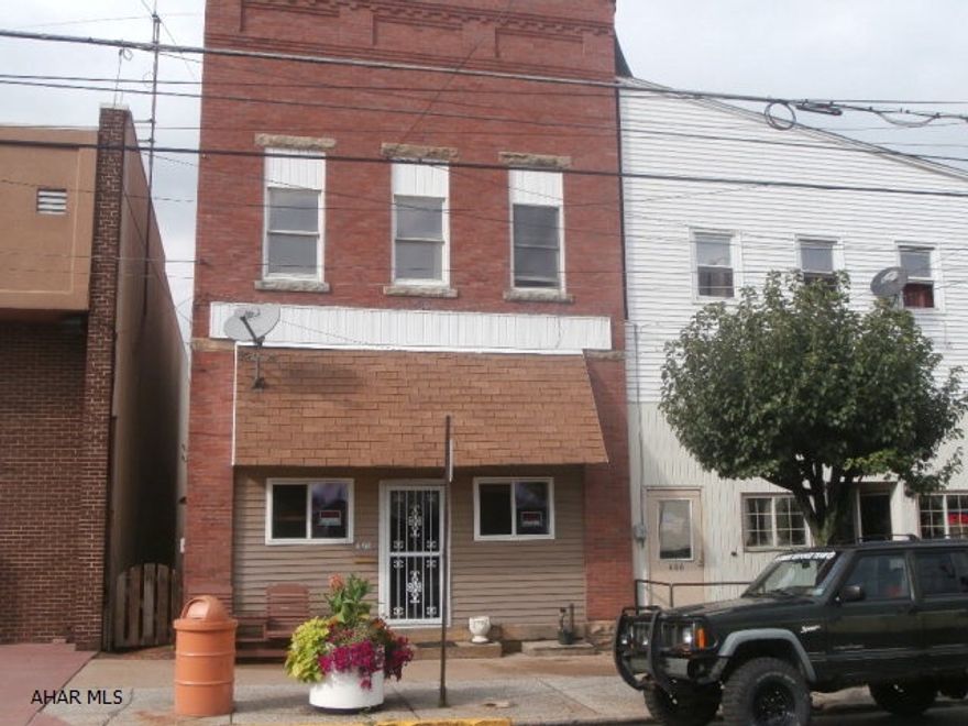 Partially remodeled two story brick set up as a single family. Off street parking at rear. Could be storefront or duplex also.