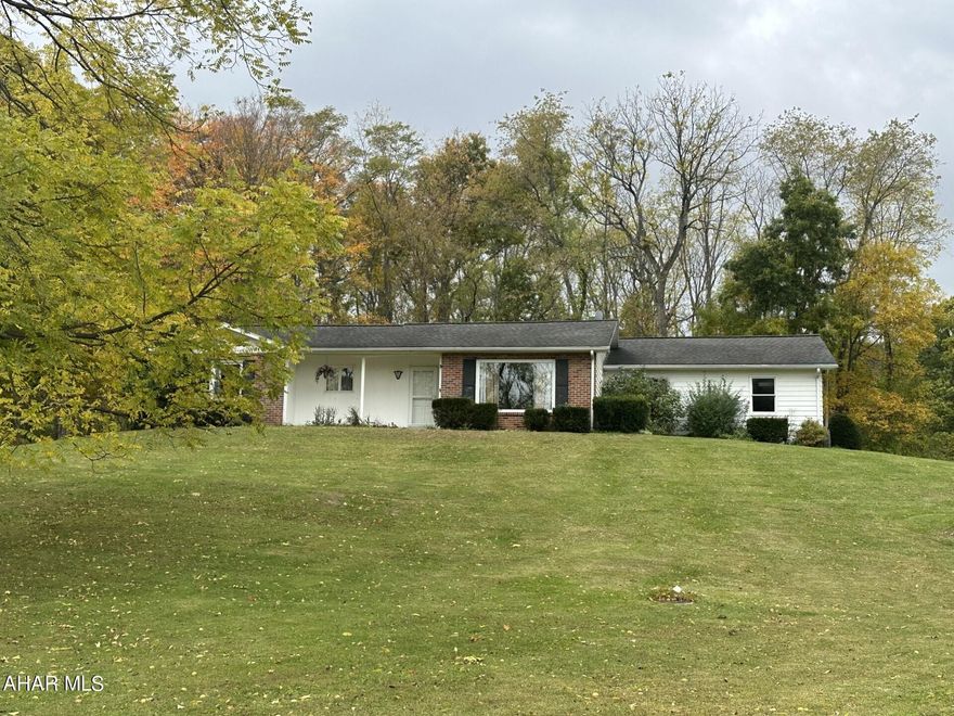 This charming 3-bedroom ranch is situated in a quiet neighborhood, convenient to shopping and other area amenities as well as UPMC Bedford.  This home features an open floor plan, over-sized 2-car garage and a beautiful, covered patio which overlooks the grounds studded with mature trees.  From the front porch the countryside views are just lovely. Come check out all this property has to offer.