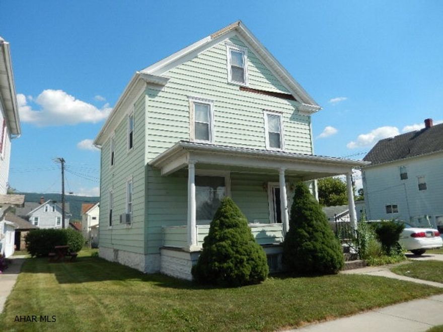 Spacious 70x120 lot features detached oversized garage and covered front and back porches.  Low property taxes, updated mechanics and new furnace!  Home offers large room sizes and carpet over hardwood floors.