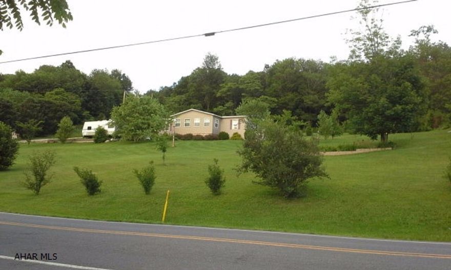 Well maintained doublewide on just over an acre in Bedford! This home has a nice open floor plan with a master bath and double closets. This rural setting is great for added privacy. This home also features a 14x30 workshop out back that has electric ran to it. The title to the home has been retired  and does qualify for FHA financing depending on lender. Call listing agent today for your showing!