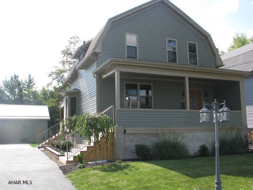 Over the course of the last three years this home has had all the windows replaced along with 3/4 inch insulation behind the new vinyl siding. You will have some serious savings on those heat bills!! A large two car garage was built as well as the property was landscaped.  Beautiful stone walls along with low maintenance plants gives this home the curb appeal we hear so much about today.  The interior of the home also received a total makeover.  Beautiful hardwood floors have been installed in the majority of the home. Structural changes were made to give the first floor a more open concept.  The kitchen bar is made of stacked stone which is very today and lends itself to whatever dcor you prefer.  The glass backsplash in the kitchen only enhances the beauty of the cherry cupboards.