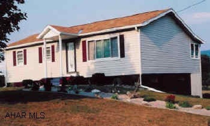 Ranch and beautiful landscaping - storage shed - garden area - paved drive.