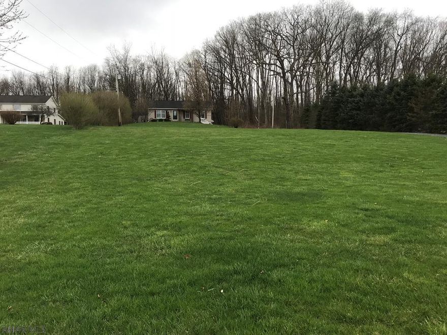 Great setting on alittle over an acre of partially cleared and partially wooded ground.  Adjacent to State Game Lands.  Immaculate one story home with oak kitchen, all kitchen appliances, deck in rear to watch the wildlife, pond with goldfish, possible 3rd bedroom on lower level.