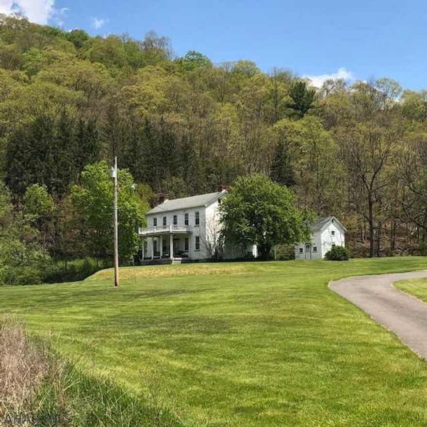 Come take a look at this majestic four bedroom country home loaded with charming attributes and lots of local history. You'll be amazed at the sheer size of the homes welcoming rooms, unique built-ins and five fireplaces.  The outdoor views and tranquil sounds from the spring fed pond's rushing water will relax and calm.  The old summer kitchen could be converted to a guest house, studio or office.  There is great potential for a horse farm utilizing the large front field.  The possibilities for this property are many. Schedule your showing!