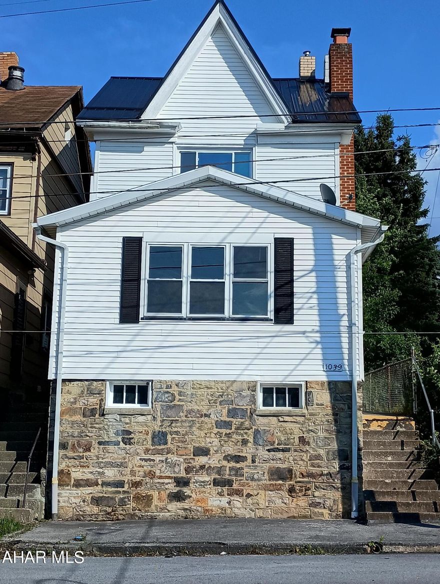 Very Large Remodeled 5 BR 1 Bath Home with 2 Off Street Parking Spaces off the Alley. Excellent Living Space and Layout with NEW FLOORING THROUGHOUT, Freshly Painted, Fireplace in the Living Room, First Floor Bedroom (can be used in a variety of ways), First Floor Laundry, and Private Covered Patio in the Back.