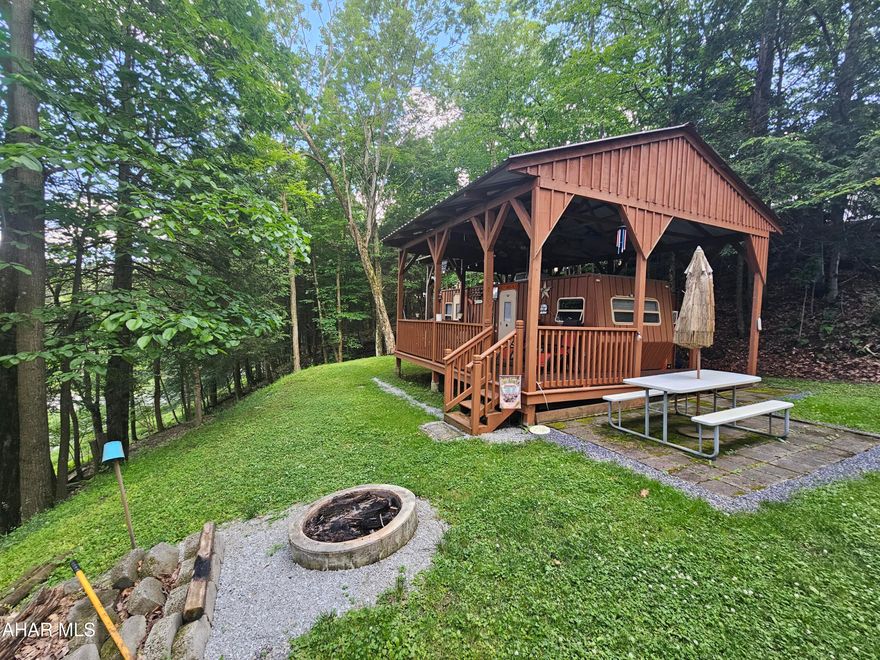 2000 camper with 1 bed and 1 bath on 1 lot inside Glendale Yearound. Deck and pavilion over camper. Glendale Yearound is a gated community located minutes from Glendale Lake and Prince Gallitzin State Park. Community pool, tennis court, basketball, security, and more.