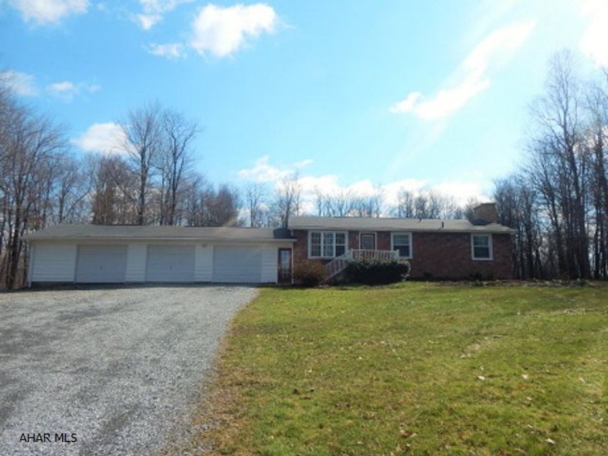 Private! Wildlife! On 4.8 acres! 1 story modular with 3 BRs, 1 3/4 baths, Full finished basement with Huge Family room with fireplace. 3 car garage.