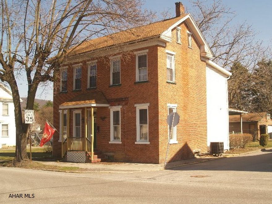 This historic brick home in Martinsburg sits on the main road through Martinsburg close to everything the Boro has to offer.  With three bedrooms and two and half baths this is the perfect size home.  There is both a heat Pump and natural gas forced hot air.  Newer roof and updated thermo pane windows.  The large eat in kitchen has lots of counter and cabinet space.  The formal dining room is huge and perfect for hosting your large gatherings.  A two car detached garage provides off street parking.  Enjoy the character of historic Martinsburg on your wrap around porch.  This house just needs a little TLC to make it the perfect home.