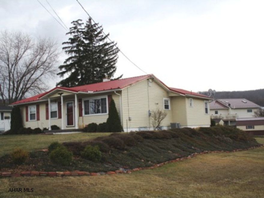 Nicely maintained. Updates: newer metal roof, gutters/downspouts, vinyl-clad DP windows (except in bath), bath updates, CA, water heater, 200-amp elect.panel, blacktop drive. Extras: Ceiling fan-lights; some hardwood floors (under carpet); E-In kitchen w/oak cabinets; private master bedroom w/ Ensuite 3/4 bath; formal dining rm.; private rear deck; automated, OH basement door for mowers/lawn equipment. Large yard which includes extra side lot. Orig. home built 1954+-; addition built 1984+-. SF of GLA & room sizes are approximate/NO GUARANTEES.  Taxes do NOT include the Homestead Exemption; current owners' annual taxes with H.E. are $880.00+-. Notation: New owner would need to apply & be approved to receive a Homestead Exemption.