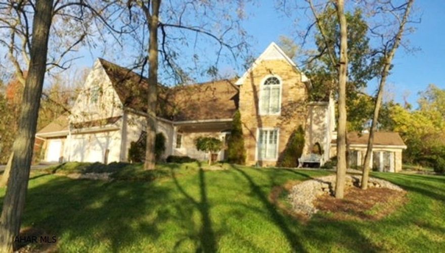 Original owners of this custom built home which includes more upgrades than you could imagine. The kitchen was recently updated and includes granite tops, top quality cherry cabinets and all new appliances within the year. The 3 season sun room features vaulted ceilings made of California cedar. Dining room has wet bar, pocket doors and wine refrigerator. The large living room features vaulted ceiling, French doors and gold trim on fireplace. The cozy rear den has a fireplace. The master BR suite features over-sized crown molding and recently renewed bath with heated floor and top of the line jet spa. The over-sized laundry area is conveniently set up in the second floor, 4th bedroom. If electric fails there is a generator fired by natural gas.