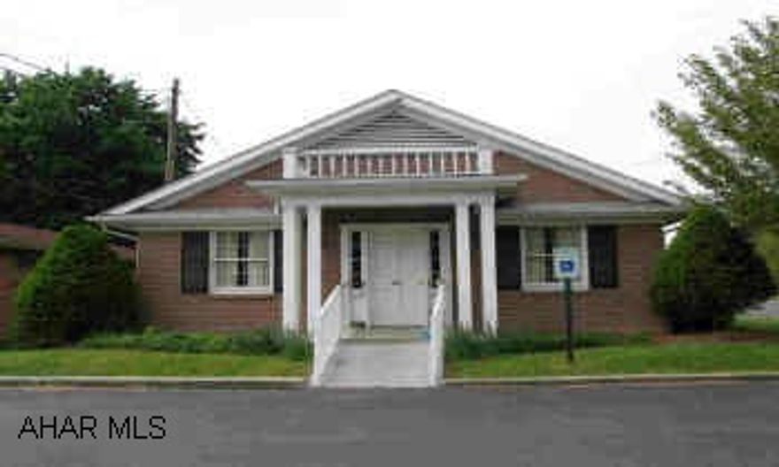 Office Building, previously used as Doctor's office. One-Story Brick building with paved parking lot. Waiting room, 2 offices, 2 exam rooms, utility room, 4 rest rooms. Has car port (12'x17'8")