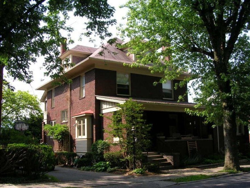 Classic Borough Brick.  Living room with brick fireplace, charming sunroom with fireplace, formal dining room with window seat.  Kitchen remodeled with breakfast bar and pantry.  2nd floor balcony off one of the bedrooms.  Well landscaped yard.  Finished 3rd Floor with Bathroom.  Covered porch off the second floor.