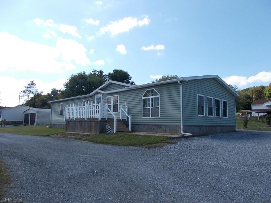 Super large doublewide on .25 acre lot in the Spring Cove School District...Super large LR/Family room with fireplace and super large bonus room ready to finish for more living space. Clean and ready to move in.  Newer roof, heat pump