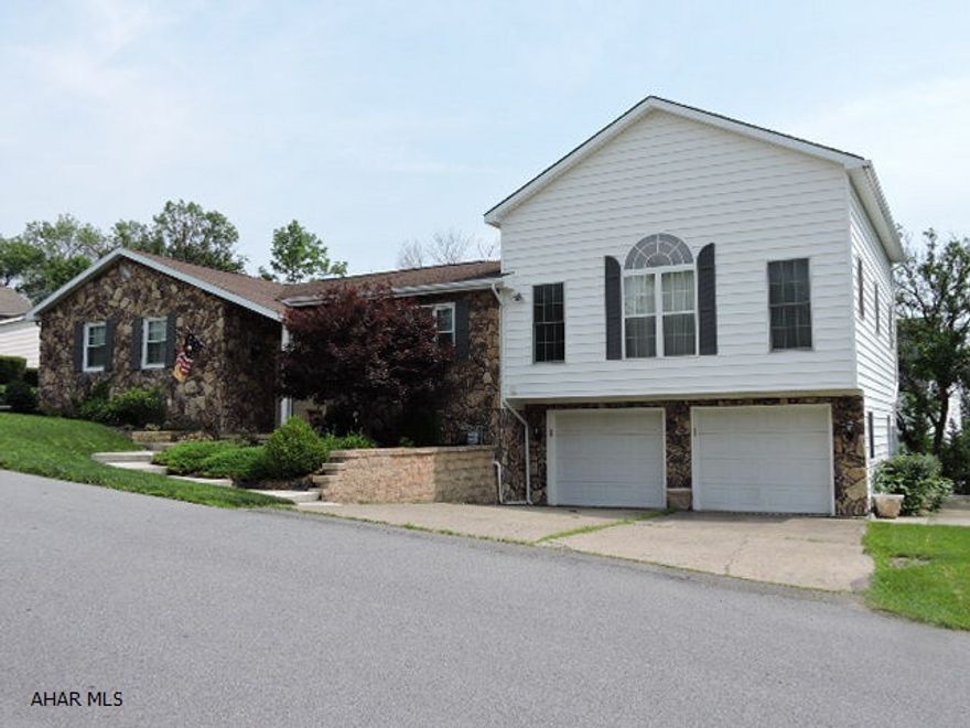 Currently listed below appraised value.  Stunning new kitchen with center island and copper farmer's sink.  Luxurious master suite addition with large walk-in closet and huge bath.  Oversized 2-car integral garage with workshop.  First floor laundry room.  Spa room off rec room has hot tub and outside entrance.  New carpet, new air conditioning, new energy efficient front door and picture window with transferable warranty.  Average utilities - gas $234, electric $75, water/sewer $95.  Well landscaped with water feature.