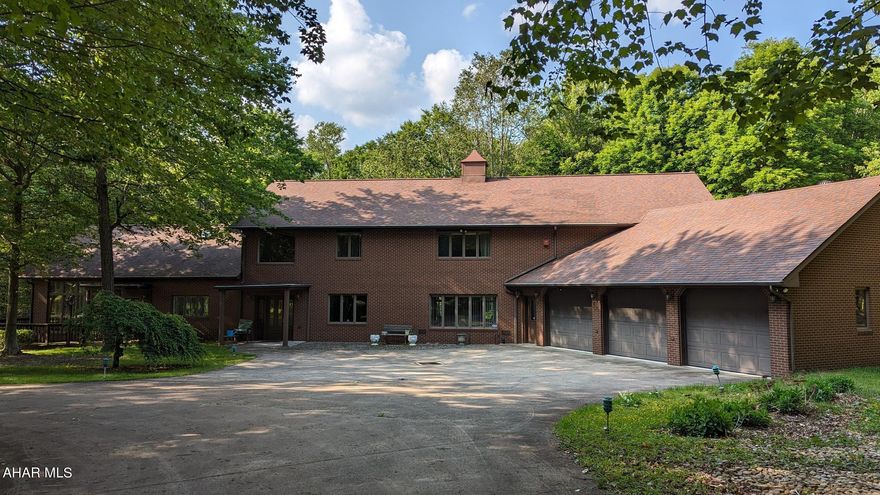 This property is a spacious 5100-square-foot home that offers two separate living spaces. On the right side, there is the main house which features 4 bedrooms, 2.5 bathrooms, a four-season room, and a finished lower level. The main house has an open-concept design with a large family room, a bright dining room, and an oversized island in the kitchen. It also includes a cozy fireplace and access to a four-season patio or a full-length deck that runs along the house. On the left side of the property, is the original cottage with two bedrooms and 1.5 bathrooms. The cottage's great room has a vaulted ceiling and a fireplace, creating a warm and inviting atmosphere. Both the main house and the cottage have recently been remodeled, ensuring that they offer modern and updated living spaces. In addition to the living spaces, the property features two outbuildings. The first is a 6500 square foot metal building with two 12 ft garage doors. This building is versatile and can be utilized for various purposes such as a car enthusiast's garage, a workshop, or a repair shop. It also includes an area for an office, providing additional workspace options. The second outbuilding on the property houses a whole-house generator, ensuring an uninterrupted power supply, as well as an extra garage for storage purposes. The property itself boasts additional amenities, including a pond and an area that could potentially be fenced to accommodate animals. It also has apple trees and a few active grape vines, adding to the natural beauty of the surroundings. With its spacious living areas, versatile outbuildings, and various outdoor features, this property offers great potential to fulfill your dreams and accommodate a range of interests and activities.