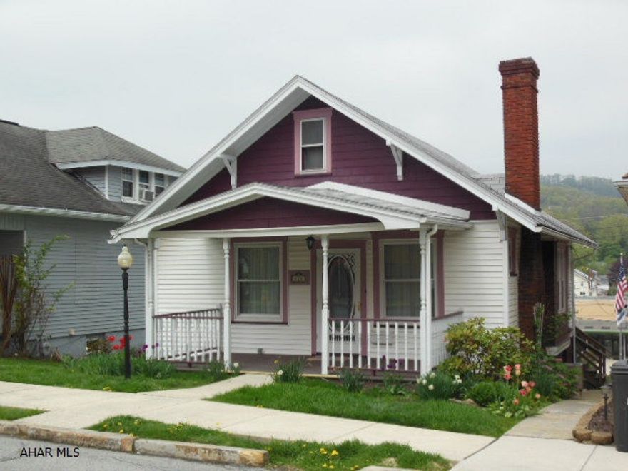 Reduced !!  Cute as a button 2BR Gingerbread home with 2 nice sized bedrooms, updated full bath, large livingroom with a gas-log fireplace, and updated prep kitchen. New first floor laundry added! Appliances: stove & hood, refrigerator, washer & dryer. Small attic for storage only and a full basement with a walk out to a rolling yard. Nice neighborhood! Good roof! Priced below a recent appraisal.  Room for off-street parking also.