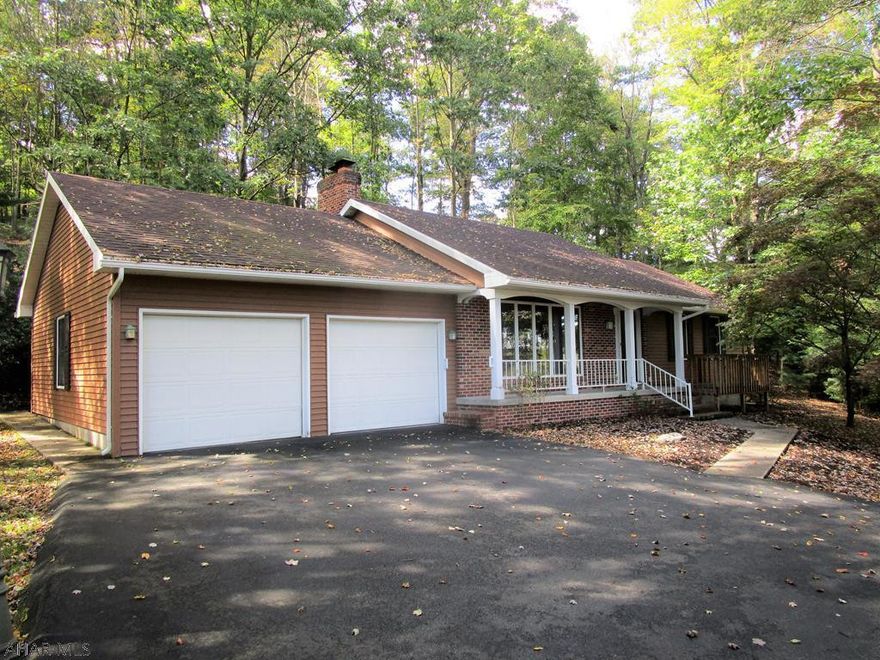 Location, location, location!!! Well appointed ranch home resting in Barclay Manor, just a short stroll to the downtown area and all amenities. The main level of the home offers a walk-in foyer, LR with brick hearth fireplace & picture window, eat-in kitchen with cer. tile floors and a wood stove, main level laundry room with multiple closets, three bedrooms and 2.5-baths. Full basement, updated heat pump with central air-conditioning and 200-amp electric. Brick cased & vinyl siding, covered front porch, deck and rear patio. Two-car attached garage & macadam driveway.  Wooded lot for privacy and nice views!!