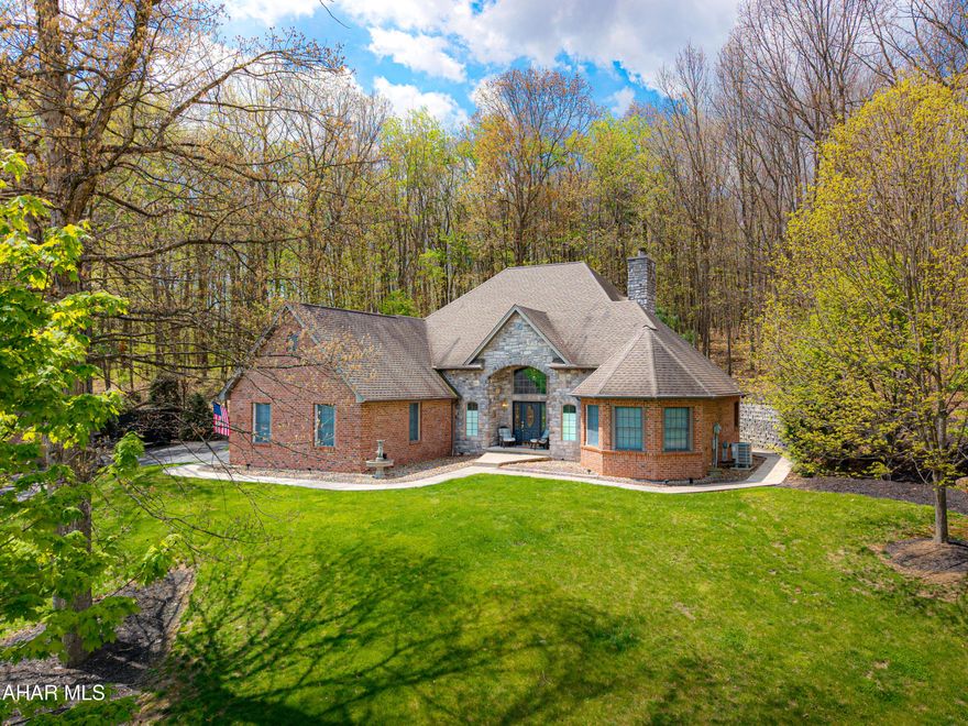 Gorgeous Custom-Built Home in Ridgewood Heights Development. This home was beautifully crafted with a blend of stone and brick and is nestled at the end of a cul-de-sac. This modern residence offers an impressive two-story foyer that invites you into a world of both elegance and comfort. The open staircase creates an impressive focal point, setting the tone for this exquisite home. Spacious two-story great room, where natural light pours in through large windows, illuminating the fireplace that serves as the perfect gathering spot for family and friends. The main level features a beautiful owner's suite, complete with a cathedral ceiling, a spacious walk-in closet, ceramic tiled bath with and a double bowl vanity. Unwind in your private sanctuary after a long day complete with blackout blinds for those lazy weekend mornings! The adjacent kitchen is a chef's delight, featuring a center island and new custom appliances that make cooking an absolute pleasure. Host dinner parties in style in the formal dining room, where memories are sure to be made. Spacious half-bath to accommodate guests and a ceramic tiled main level laundry for owner convenience. Upstairs, you'll find two additional bedrooms along with one full Jack and Jill bathroom that's perfect for accommodating family members or guests while ensuring everyone has their own space. Venture downstairs to the well finished basement that offers versatility for entertainment or relaxation. Complete with its own fireplace, this space is ideal for cozy movie nights or lively game days. Another half bath here makes for perfect convenience. This home is superbly maintained and freshly painted throughout, providing an inviting atmosphere ready for you to move right in. Enjoy year-round comfort with a newer Bosch heat pump equipped with central air conditioning. Situated on a tree-lined lot close to schools and amenities, this property combines tranquility with convenience--an ideal location for those seeking both privacy and accessibility. Elegant hardwood floors, ceramic tile floors, recessed lighting, propane starter fireplaces, arch top windows, paved driveway, and custom landscaping. Your new dream lifestyle awaits!