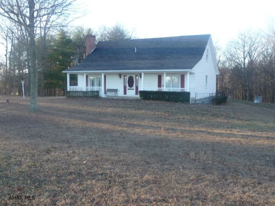 Spacious, two level home with large, oak, eat-in kitchen, w/ceramic tile floor. Also includes a large living room wood burning fireplace surrounded with beautiful Ohio sandstone for accent.  A large family room with wood burning stove, first level Master suite with full bath, two second level bedrooms w/2nd full bath, spacious first floor den/office and attractive hardwood flooring. A large yard, wooded area, 20'x24' storage shed and quaint front porch complete this perfect country property.