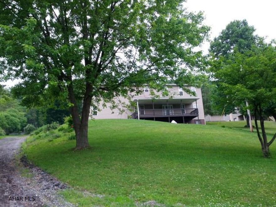 Hollidaysburg Schools. Spacious 5-bedroom, 3 bath home with eat-in kitchen and formal dining room, whirlpool tub, newer furnace & central air, covered front porch and nice back deck 1.3 acre country setting. #J-256
