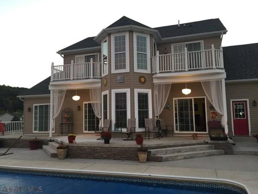 MOTIVATED SELLERS! Intriguing & impressive home that boasts quality throughout from the two-story foyer to the extensive outdoor living area. Built for entertaining! The foyer flows naturally to the Great Room, dining, & kitchen- all areas offering intimate yet luxurious gatherings. You'll appreciate the attention to detail from the 2-story wall of windows, fireplaces, granite, & marble throughout the 3 full floors of living space. 1st floor Master suite is sure to please w/ a Jacuzzi tub, fireplace & walk out to the hot tub!  Half bath & mud room/laundry room complete the 1st floor. 3 BR, office, bonus room w/ bar & full bath on the 2nd floor, all rooms offering mountain views. Impressive 32'x16' heated pool, outdoor kitchen, hot tub, stamped concrete, decking, professionally landscaped.