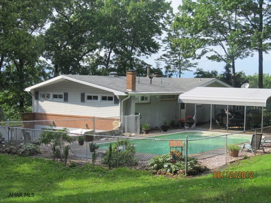 This Charming, yet modern home sets on a secluded 1 acre lot.  Swim in your private in-ground pool discreetly and then rest your warm body under a nicely shaded covered patio next to the sounds of a running pond.  Enter inside to a modern Kitchen with built-in cooktop right into your breakfast island.  If that's not enough...enjoy cooking and baking simultaneously with 2  built-in ovens. Roll out a hot dinner and dessert the same time and impress your company.  A large Dining area, and a sweet Living area with a vaulted ceiling.  Your also will not be disappointed with 3 spacious bedrooms, a tremendous Sunroom with a picture view from the 'hot tub' that sets within it.  Then walk downstairs to an finished rec room with a pool table,snack booth, bathroom and a separate TV room.  Just..WOW!!