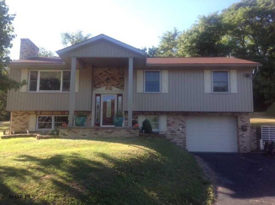 Great Pleasant Valley location.  3 bedroom, 2 bath, 2 fireplaces.  New vinyl siding, new rear patio, new Fujitsu split A/C system.  Updated Maple kitchen with solid surface counters, s/s appliances, ceramic tile floors.  Hardwood and solid 6 panel wood interior doors.  Family room with fireplace.  1 car garage.