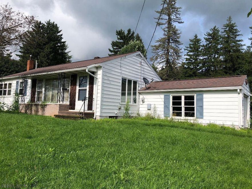 Cozy ranch overlooking Orchard Heights. 2 bedroom, 1 bath, spacious living room with hardwood floors and large picture window, eat in kitchen. Full basement, attached 1 car garage. Sewer is through Bedford Township. Water is through Bedford Borough.