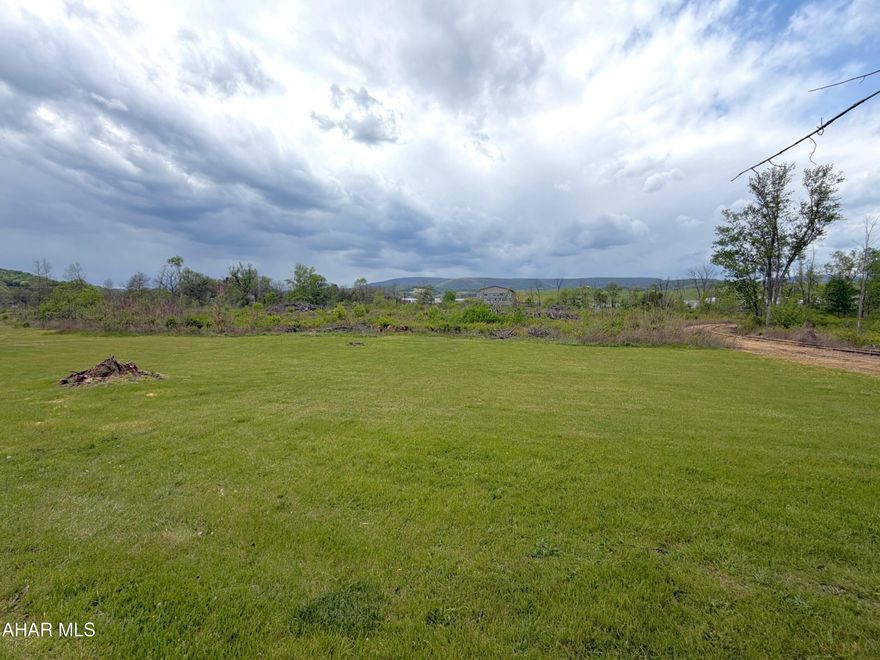 Commercial land in southern Blair County, PA available for lease!! 1-17 acres for lease, you choose the size you need. Terrific location just off I-99 and next to a business park. Land has a rail spur, mostly level topography, and easy access in and out. Corner lot with public road frontages. Owner is willing to do a build to suite for a warehouse, truck docks, professional or medical offices, or other uses. $1,200 per acre, per month. Price will vary depending on the amount of land needed or if a build to suit is completed.