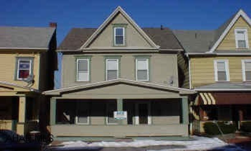 Spacious rooms, 3 bedrooms, enclosed porch, newer roof and furnace.