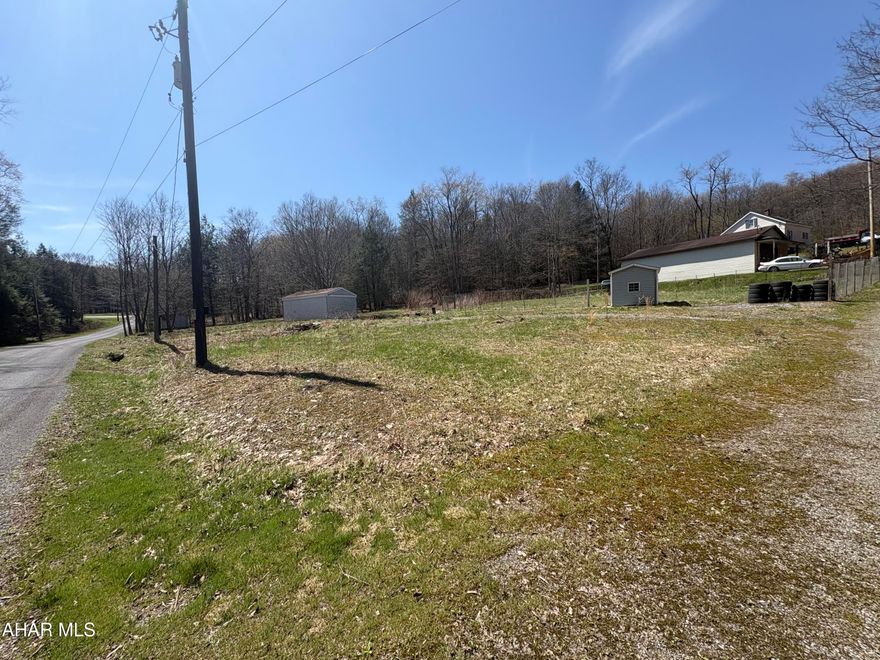 Looking to build or have additional space for recreational activities? 338 Turkey Path Road & 115 Sheffield Street, Nanty Glo, are now available. Each lot is 0.5 acres and is deeded separately. These side-by-side lots form a corner lot totaling 1 acre. 338 Turkey Path Road has electric with a garage and shed on the property. 115 Sheffield Street has a shed on the lot. Both lots have hand-dug wells. The garage has a cement floor and is insulated. All buildings are approximately 20 years old. Call listing agent for more information.