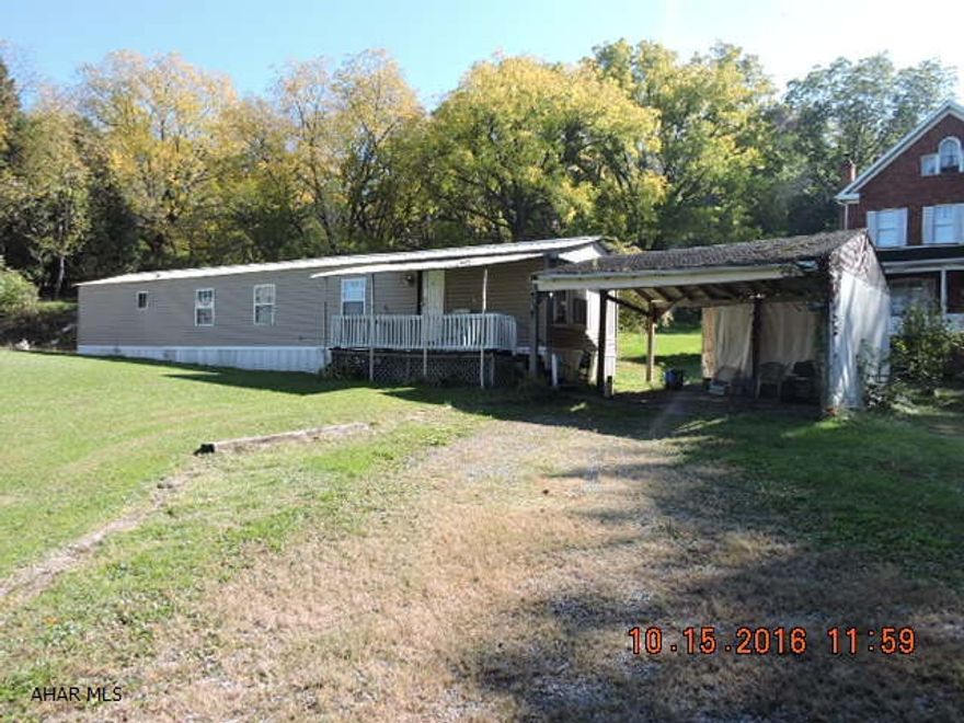 14x66 Single wide mobile home on piers with many improvements including roof, windows, siding, furnace, kitchen & bath remodeled, and all within last 4 years.  Block garage is 32x30 & has 2 pits for working on vehicles.  The attached frame garage is 15x21.  New carpet is there, but not installed , and will stay with the house. List price is based upon recent appraisal. Reassessment value is 81,000 and estimated taxes $850.52.  Seller is not appealing.