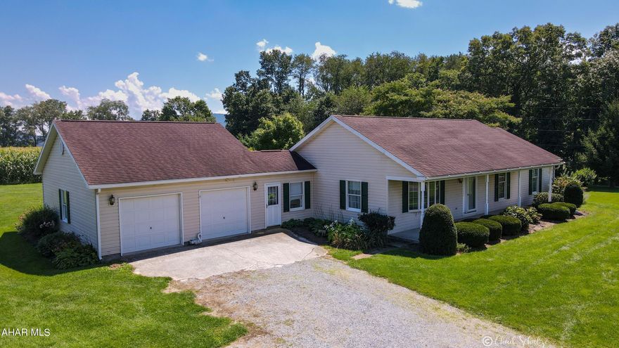 A slice of heaven nestled in between the mountains of the Southern Cove area, Northern Bedford School District. On top of a ridge are quiet sunrises and breathtaking sunsets. This home sits on 1 acre along the Replogle School Road. Surrounded by lush farm fields and friendly neighbors, the one acre parcel is flat and adorned by a 1,456 sq ft Foremost ranch house. Oversized 2 car garage has plenty of room for extra storage and a workshop. Enclosed breezeway that enters into the kitchen with oak cabinets and recessed lights. Living room with bow window to allow expansive daylight. Dining room exits to large, covered back patio. Open foyer, hall linen closet, full bath with oak cabinetry. All three bedrooms have ceilings fans and closets. Master bedroom has master bath with walk in shower. Home stays cool even on the hottest of days with the constant flow of air through the windows. Full open basement is cool, clean and ready to be made into whatever you want it to be. Mature landscaping is beautiful during all of the blooming seasons. Front covered porch to catch the evening sunsets or catch a farmer plowing a field. Serene and quiet. Exactly what you're looking for.