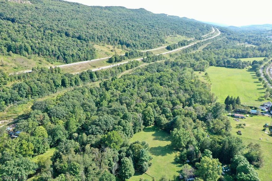 Approx 6 acres of wooded ground with lots of possibilities.  Public sewer available.  Plot lines in green are approximate.