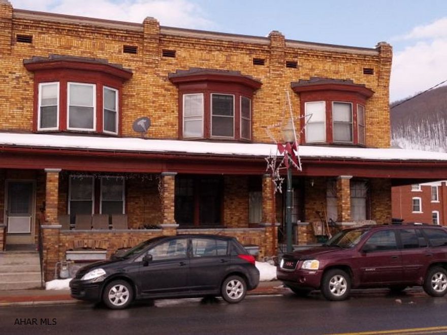 This unit for $26,900 or buy units 106, 112, and 114 (all 3) for package price of $78,900. Brick 2 story 3 bedrooms, nice woodwork and covered front porch.   #J-227