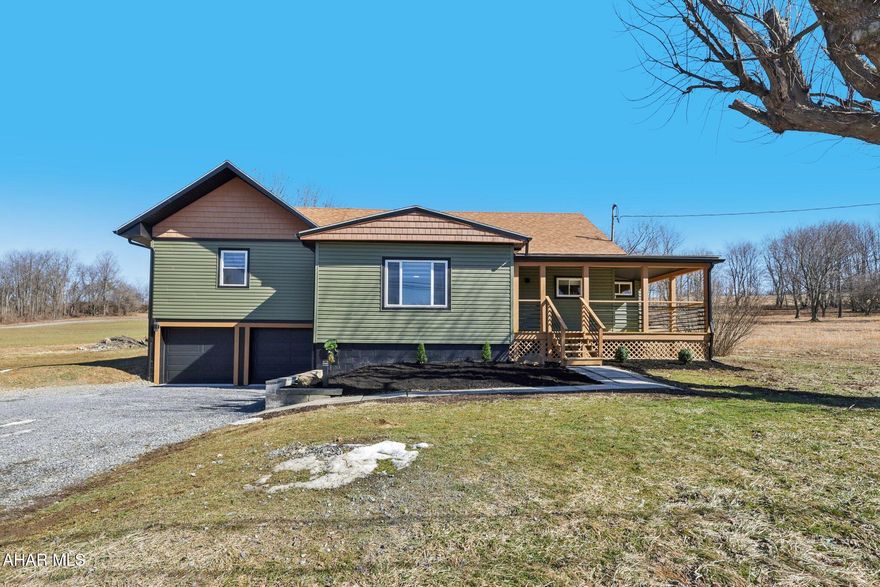 Entirely renovated and modernized home in the country just waiting for its new owner. Every inch has been tastefully improved and is being made available fully furnished as seen. Walking in from the wraparound porch through the beautiful glass panel door, you'll find a lovely entryway with an excellently placed coat closet. A few more steps and you'll find the living room with a central fireplace, large windows, and an adjacent office. The kitchen includes ceiling-height cabinets with soft-close hardware and butcher block countertops accentuated by the custom tile backsplash. The large undermount sink has built-in provisions for a drying rack, cutting board, and basket drains; while the faucet includes a sprayer and pot filler. The center island and corner cabinet add convenience; while all appliances are brand new and included. Step in a little further and you'll notice a large walk-in pantry with additional cabinets and countertop space... you couldn't ask for more! There's a bonus media room just off the dining room and which also provides access to the rear deck. The room darkening curtains throughout allow for variable light levels. The laundry area is conveniently located near the bedrooms and the stackable washer/dryer combo can be found behind the clever bi-fold barn doors. And don't forget the built-in storage cabinet just to the left of that. The master bedroom includes two large closets and a full ensuite bathroom with a beautiful tile floor and the perfect blend of finishes and hardware to give it a crisp look and feel for years to come. The third bedroom and another full bath equally as nice are located on the main floor. The walk-up attic provides a ton of storage space for all of your seasonal items and the basement has so much potential for additional living space, play areas, workshop, or anything else you can imagine. It even provides access to the large 2-car integral garage with both doors having auto-openers. Then head back outside for another look at the large flat yard surrounded by tons of open space with plenty of room to breath. You won't want to miss this ONE!