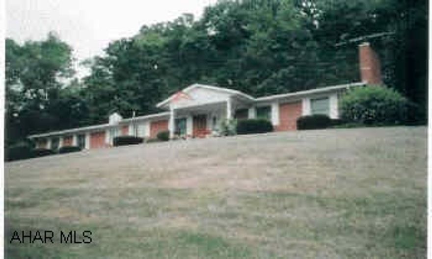 All brick custom home in the country, minutes from town, one owner. Remodeled oak kitchen, new carpet, Anderson windows, new roof, newer chimney, backs to woods. All appliances and drperies included, large workshop and family room in basement. 1st floor laundry. Woodburner and gas heating stove in basement. Nice landscaping, apple trees, garden. Cedar closet, french drains, lovely home.