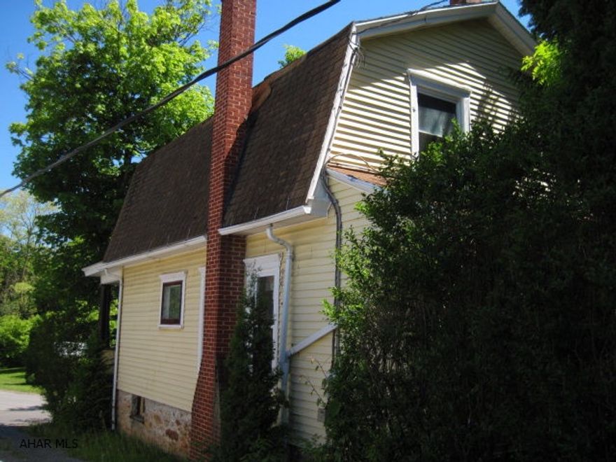 This 2 1/2 story home with large closets for storage along with attic space. It has a shed and 2, two car detached garages. Additionally the property is set on two adjoining lots. The exterior is constructed of brick and vinyl and the interior has unique wood work. This house has much potential and is all set for needed improvements. Call listing agent for additional information regarding the upcoming auction. THIS HOUSE/PROPERTY IS IN NEED OF REPAIR AND WILL BE SOLD AT AUCTION TO THE HIGHEST BIDDER(S) ON THE DAY OF THE AUCTION OR ON ACCEPTANCE BY THE SELLER(S), AND WILL BE SOLD AS-IS IN IT'S PRESENT DAY CONDITION.