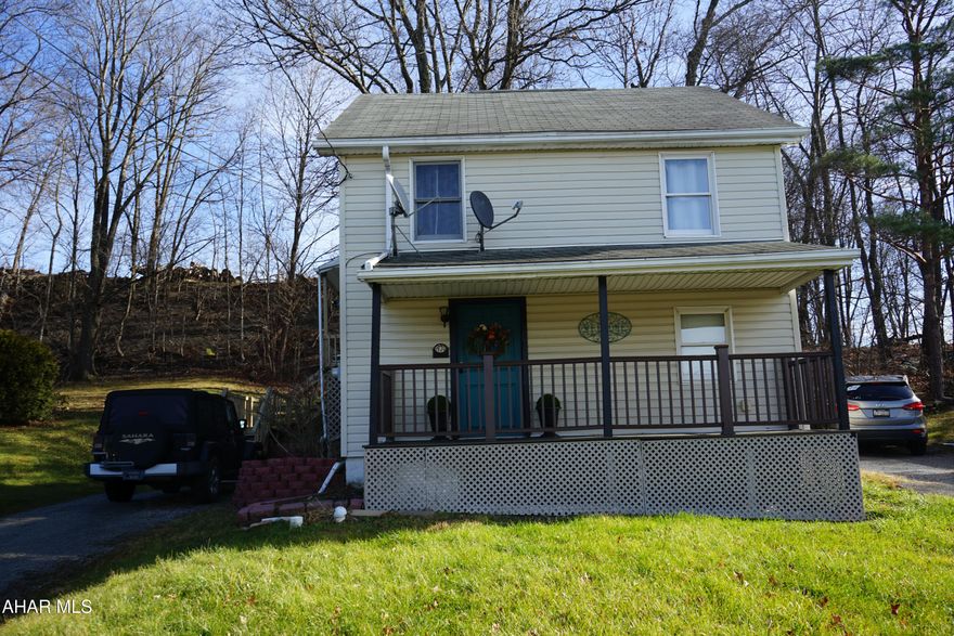 Price Reduced! Well maintained home on the outskirts of town but close to everything! Total privacy on the rear and side deck with the wooded back yard plus a wonderful view from the front porch. 1st floor bedroom with updated bathroom and 2nd floor bedroom with additional bonus room. Also there is a family room in the basement for additional living space or could be a 3rd bedroom