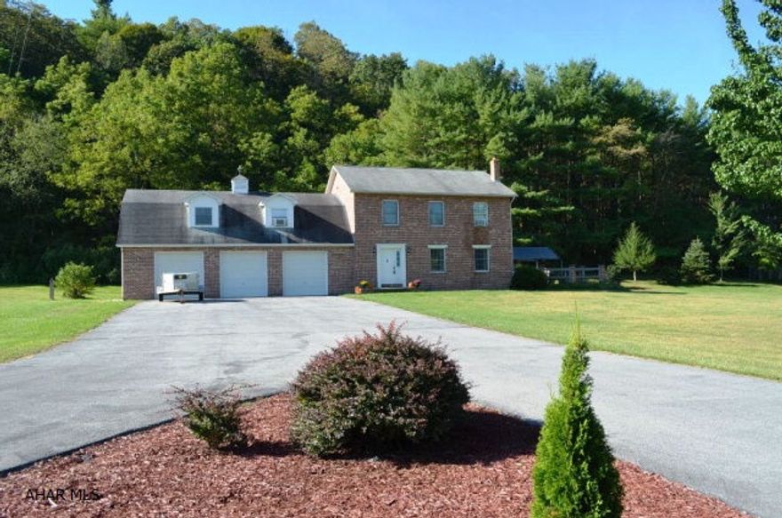 Lovely location in the Imlertown area.  2 Story Brick Colonial on 9 ac.  Large kitchen with Oak Cabinets.  Cement patio off of the dining room that overlooks the Retrieving Pond.  Land goes to the top of the ridge in the back. Family room above the 3 car garage. The location is so peaceful.