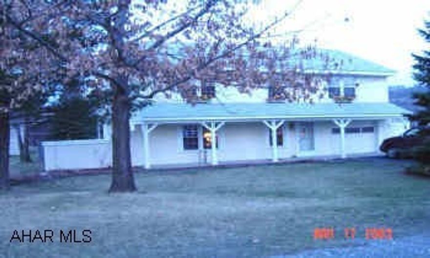 New oak kitchen, vinyl windows, large lot, low utilities (electric $80/mo., gas $32/mo.).  Large level lot with periennial flowers and mature trees.  Home Warranty included.