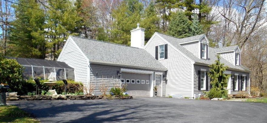 Private setting, ultimate design features & appliances  (Sub Zero refrigerator Wolfe Range) in kitchen & bathrooms. Heated salt water pool w/new Hardscape patio, attached 2 car garage & green-house. Enhanced energy efficient heating & air conditioning. Anderson Thermo Pane windows, hardwood & tile floors, gas fireplace, screened in patio, mature trees & established gardens.Seller is licensed Realtor